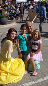 Two friends pose with their favorite Disney Princesses during Oswego's Fall Fox Fest held downtown on Sunday, Sept. 18. The event drew thousands of people to the area for fun, food and games during the free annual event. (Photo by Erika Wurst / for Chronicle Media) 