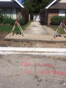 ͞Be sure no apron͟ spray-painted instructions in front of a Lyons home with a curbed off driveway. The village passed an ordinance banning driveways that don’t lead to a garage. (Courtesy Lyons Living Facebook Page) 