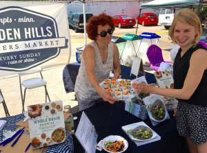 Cookbook writer and chef Robin Asbell offers “mini bowl” samples of her “Black Rice Banh Mi Bowl” recipe at a neighborhood farmer’s market. 