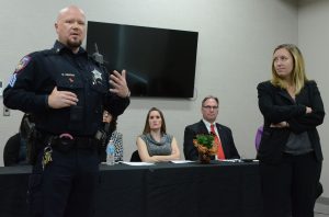 Sgt. Branden Gentry, left, Kane County Sheriff’s Department; and Elgin attorney Jamie Mosser, a former Kane prosecutor, discussed domestic violence at “Seeking Help and Hope,” a domestic-violence forum at Santori Aurora Public Library Tuesday, Oct. 25. Panelists seated are Stephanie Austin, left, domestic violence victim who founded a legal aid firm and Kane Sheriff Donald E. Kramer who hosted afternoon and evening forum sessions. (Al Benson photo)
