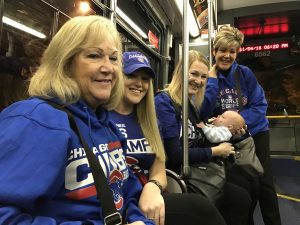 Traveling on the Addison bus heading to Wrigley Field are (from left) Laurie Goranson of Carol Stream, Haley Goranson of Carol Stream,Kirsten Taujenus of Broomfield, Colo. with daughter Aspen Taujenis and Cindi Foley of Loudon, Tenn. "It's fantastic," said Laurie Soranson of the Cubs' journey. (Photo by Karie Angell Luc/for Chronicle Media)