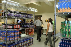 Residents and officials check out the shelving and setup of Bloom Township's new food pantry in Chicago Heights. (Photo courtesy of Leticia Gonzales/Bloom Township) 