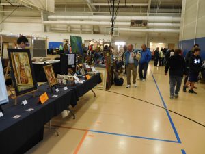 Residents at Crestwood Recreation and Wellness Center look at the various items on display during the village's Fine Art Fair. (Photo by David Pollard/for Chronicle Media) 