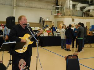 Along with items for sale, there was live entertainment, starting out with David Molinari, who played a myriad of songs on his guitar and harmonica. (Photo by David Pollard/for Chronicle Media) 