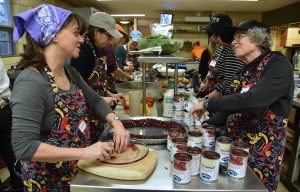 Left, Liliana Zapp of Deerfield talks with, on right, Kathy Greenberg of Evanston on Nov. 23, 2016 at the Thanksgiving-themed soup kitchen at Beth Emet The Free Synagogue in Evanston, 1224 Dempster St. On far left is Brenda Weis of Winnetka. (Photo by Karie Angell Luc/for Chronicle Media) 