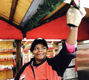 Tiffany Payton of Round Lake rings the bell at the Christkindlmarket Chicago opened at Daley Plaza in Chicago. "I like to ring the bell to welcome everyone to market," she said. (Photo by Karie Angell Luc / for Chronicle Media)