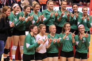 Members of the IHSA State Class 2A Volleyball championship signal their title with the letter “W.” (Photo by Kalli McDonald/for Chronicle Media) 