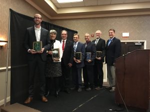 2016 Illinois Soybean Association (ISA) Awards of Excellence winners pictured with ISA chairman Daryl Cates and CEO Craig Ratajczyk. From L to R: Thomas Titus, Marcia Willhite, Cates, Todd Dail, Jason Bond, Warren Goetsch and Ratajczyk.