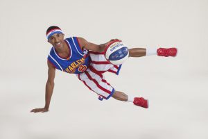 Rocket Pennington, from Chicago Heights, displays his dribbling skills as a member of the Harlem Globetrotters. Pennington is heading into his third year as a full-timer with the basketball ambassadors. (Photo courtesy of the Harlem Globetrotters) 