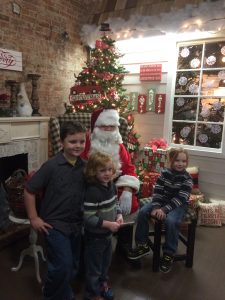 Max, Dorian and Xander, left to right, pay a visit to Santa Claus Dec. 2 during the City of Washington's annual Old Fashioned Candlelight Stroll Dec. 1.   