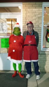The Grinch and other fun characters posed with guests during Oswego's Annual Christmas Walk held Friday night, Dec. 2 in downtown Oswego. (Photo by Erika Wurst/for Chronicle Media) 