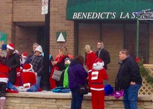 For the fourth year, runners donned provided Santa suit or a red long-sleeved shirt for the 5K walk/run, which started at the Raue Center for the Arts in downtown Crystal Lake.  