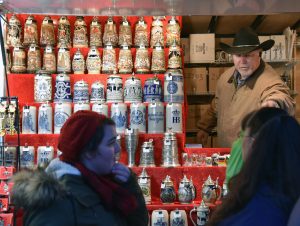 Thomas Wolf, upper right, a vendor from Germany, sells steins and other collectibles on Dec. 1, 2016 at Christkindlmarket Naperville at Naper Settlement in Naperville, 523 S. Webster St. (Photo by Karie Angell Luc/for Chronicle Media)  