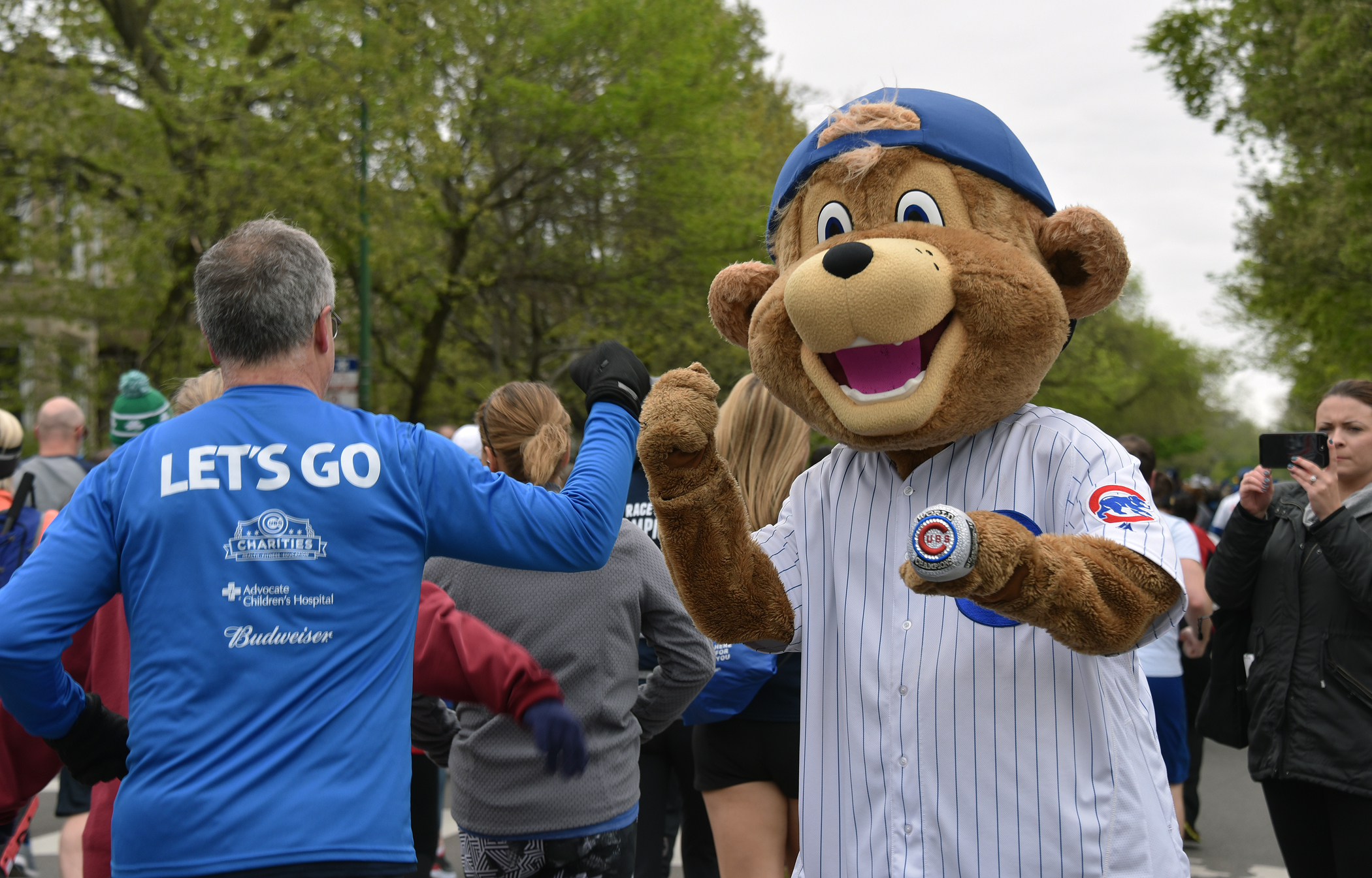 Runners show their medal in annual Race to Wrigley for Cubs Charities