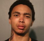 Man charged with breaking police station window