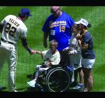 9-year-old boy injured in Highland Park shooting tosses first pitch at Brewers game