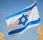 Two charged with hate crime for spray-painting over Israeli flag